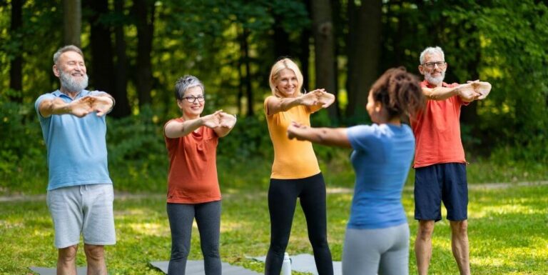 Elderly Residents Participate in Outdoor Exercise Classes at Assisted Living Facility