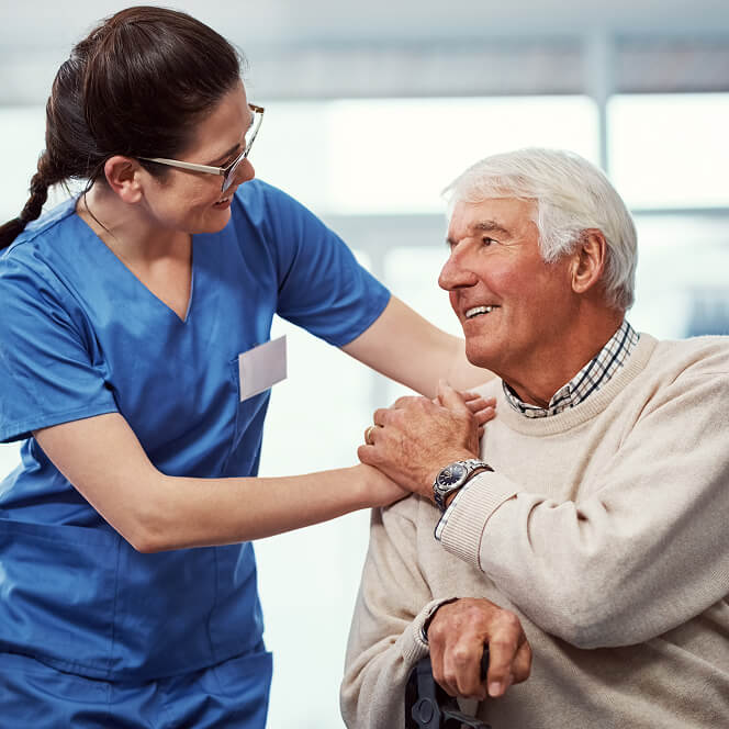Caregiver Comforting Resident at Memory Care Facility